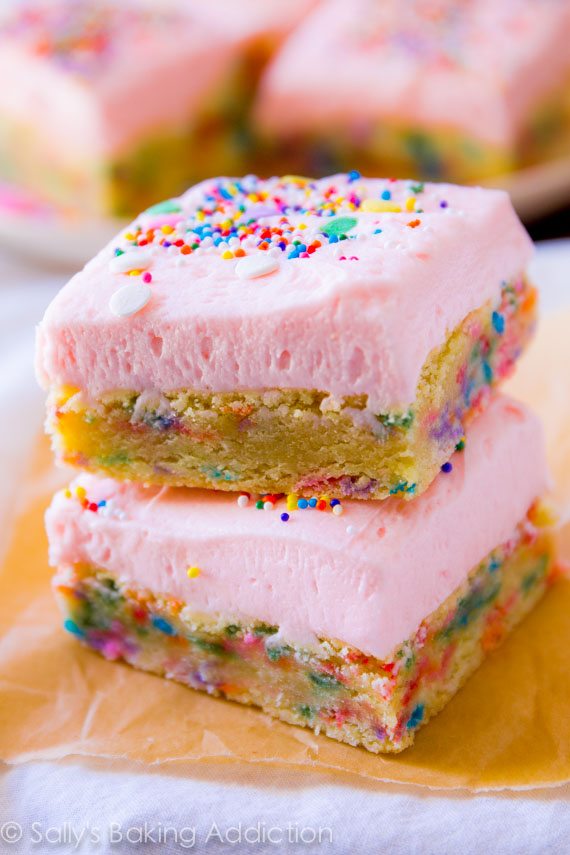 Frosted Sugar Cookie Bars - soft baked and heavy on the sprinkles! Recipe by sallysbakingaddiction.com