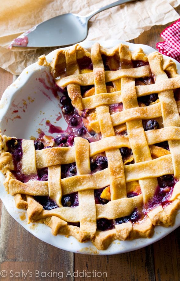 A classic lattice-topped homemade blueberry peach pie bursting with juicy flavor. You will love this pie crust too! @sallybakeblog