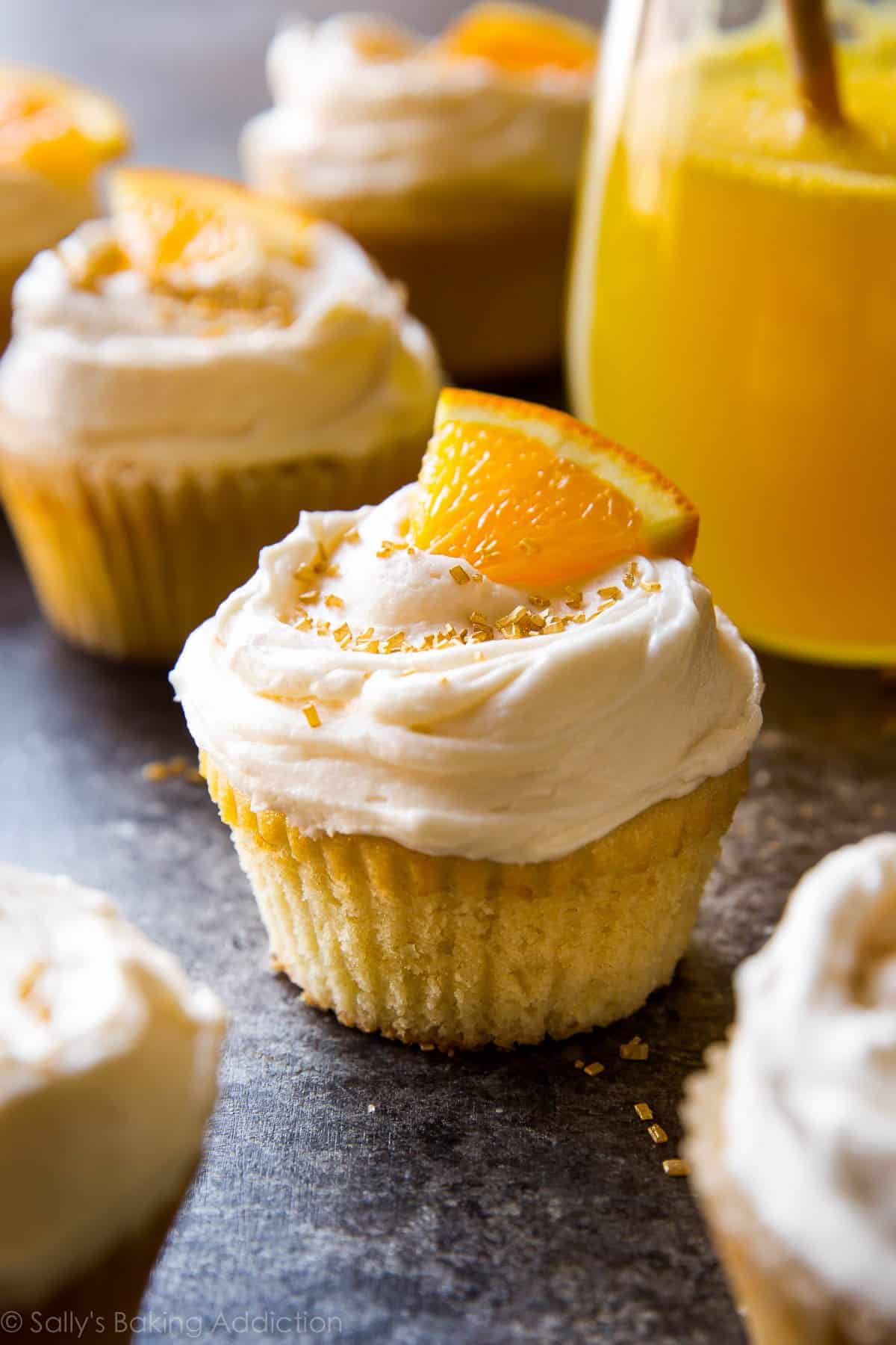 Cheers! Soft and fluffy mimosa cupcakes with champagne frosting recipe on sallysbakingaddiction.com