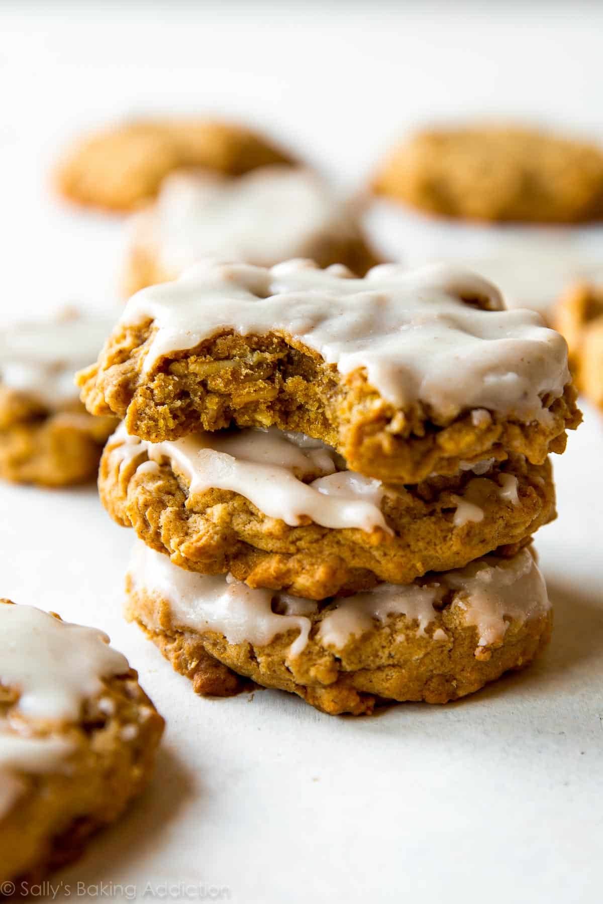 Massively flavorful and simple brown butter pumpkin oatmeal cookies with icing on top! Recipe on sallysbakingaddiction.com