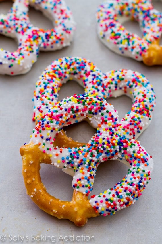 pretzels dipped in chocolate and topped with sprinkles
