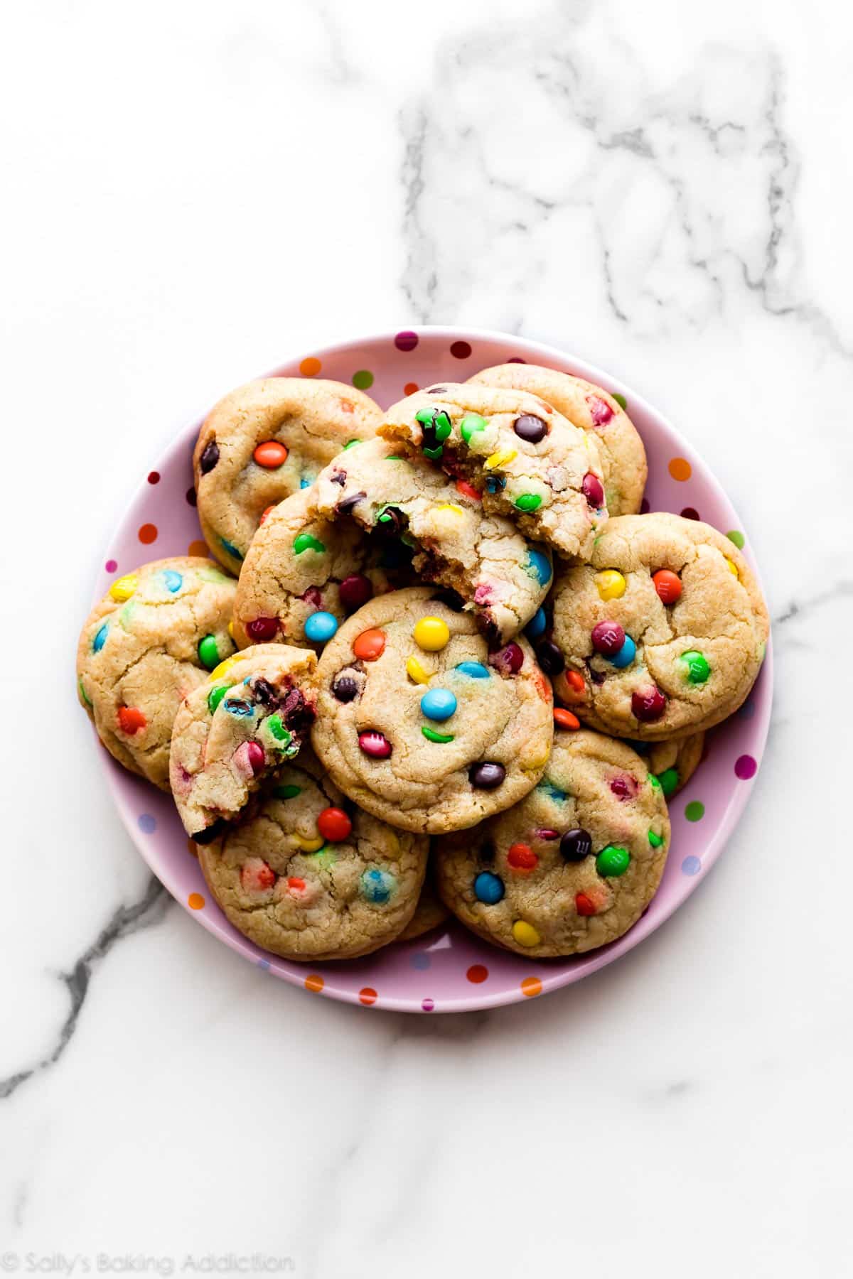 M&M cookies on a pink polka dot plate