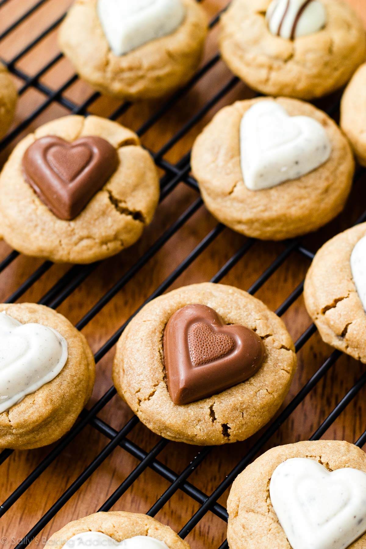 peanut butter cookies with chocolate heart candies in the center