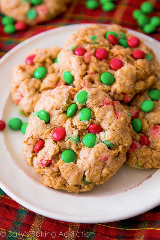 oatmeal cookies with red and green M&Ms on a white plate