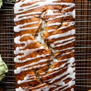 overhead photo of banana bread with icing drizzled on top.