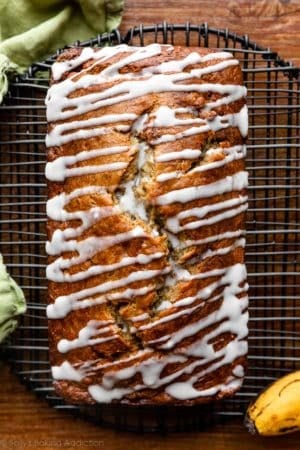 overhead photo of banana bread with icing drizzled on top.