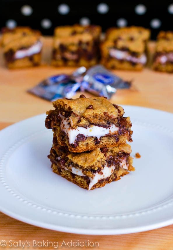 stack of chocolate chip cookie bars stuffed with York Peppermint Patties on a white plate