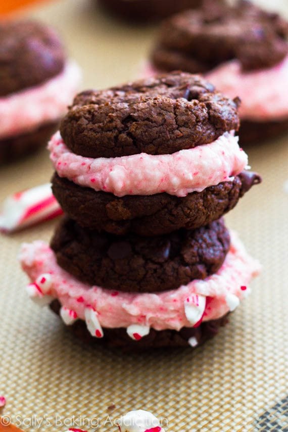 stack of 2 chocolate fudge sandwich cookies filled with candy cane buttercream