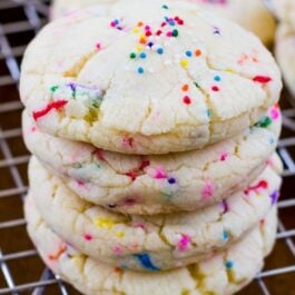 stack of confetti cake batter cookies on a cooling rack