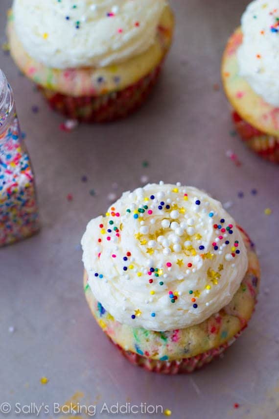 funfetti cupcakes topped with vanilla buttercream and sprinkles