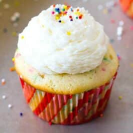 funfetti cupcake topped with vanilla buttercream and sprinkles