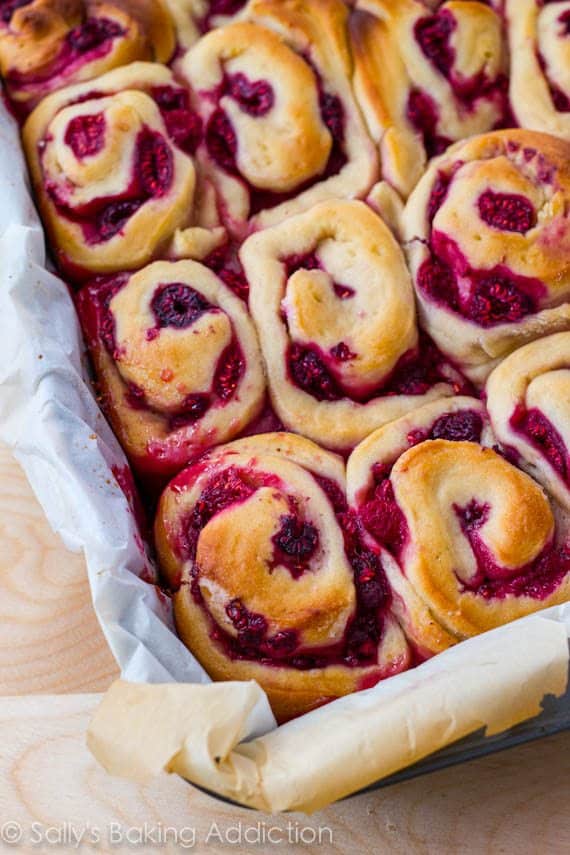 raspberry sweet rolls in a baking pan after baking