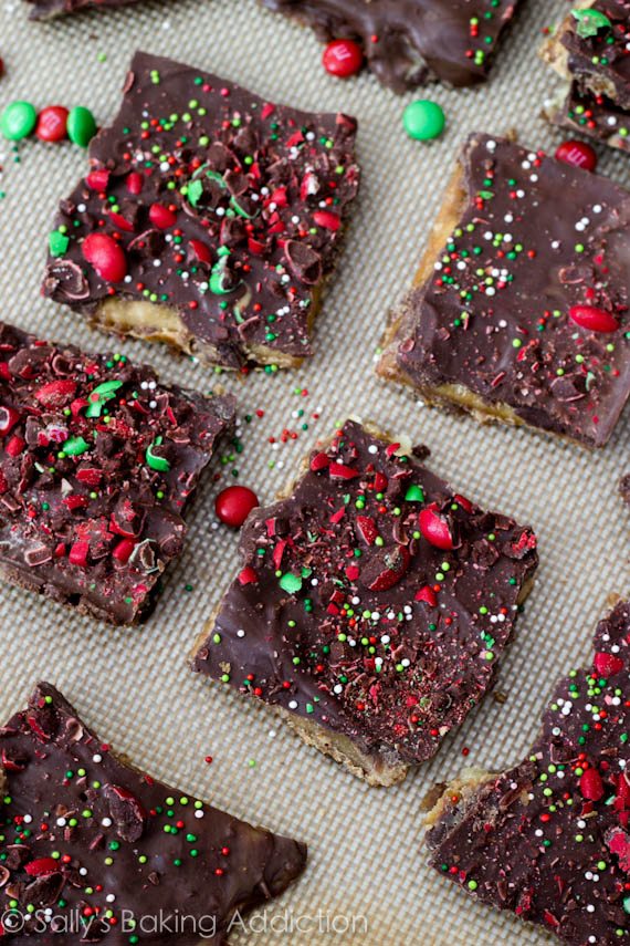 pieces of chocolate peanut butter Saltine toffee on a silpat baking mat