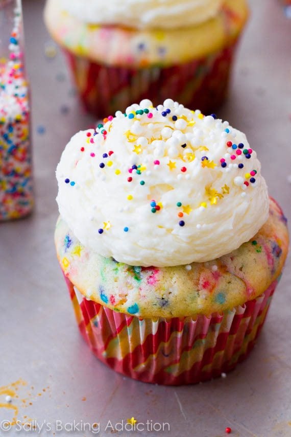funfetti cupcakes topped with vanilla buttercream and sprinkles
