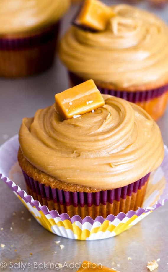 caramel cupcakes topped with salted caramel frosting and caramel candies