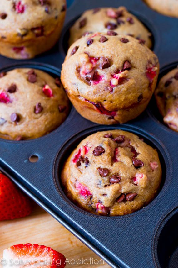 strawberry chocolate chip muffins in a muffin pan