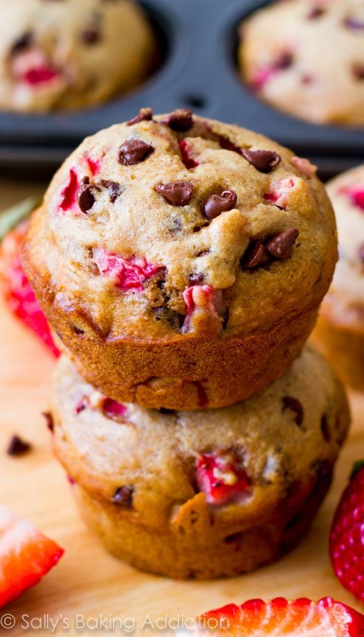 Incredible "lightened-up" chocolate chip muffins with fresh strawberries. Nearly fat-free and only 140 calories each! @sallybakeblog