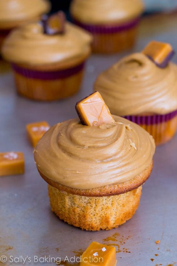 caramel cupcakes topped with salted caramel frosting and caramel candies