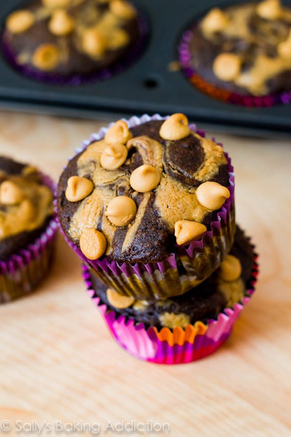 stack of 2 chocolate peanut butter cupcakes topped with peanut butter chips