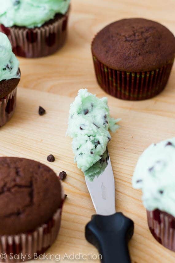 chocolate cupcakes and mint chip frosting on an icing spatula