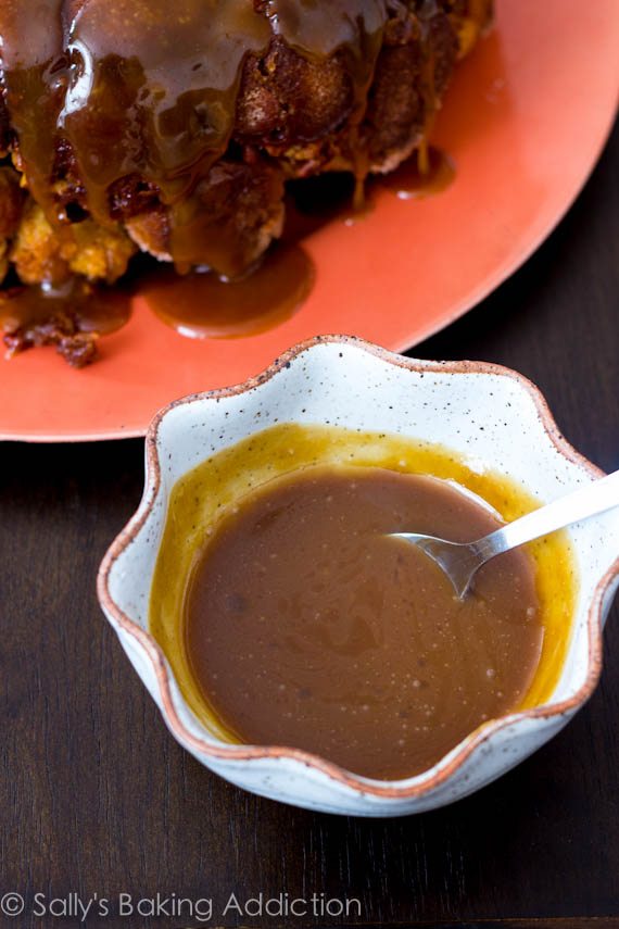caramel sauce in a white bowl with a spoon