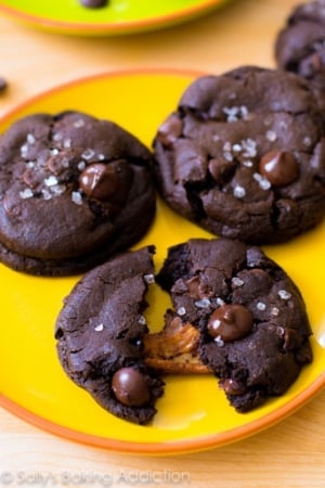 salted caramel dark chocolate cookies on a yellow plate