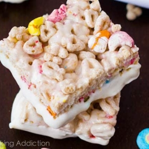 stack of Lucky Charms Treats with the bottoms dipped in white chocolate