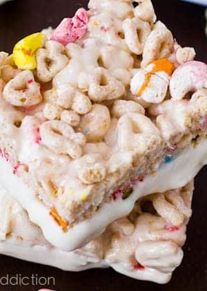 stack of Lucky Charms Treats with the bottoms dipped in white chocolate