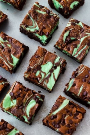 overhead image of mint chocolate chip cheesecake brownies on a baking sheet