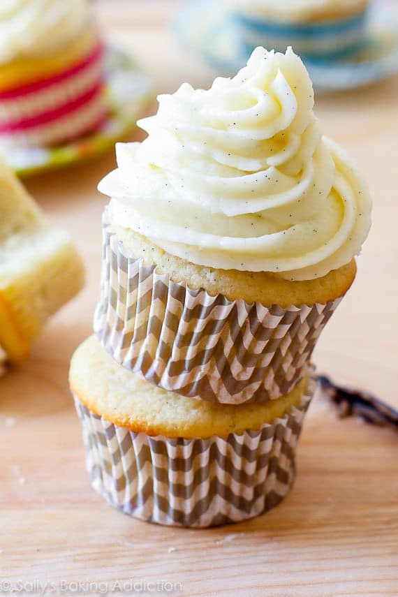 stack of vanilla cupcakes topped with vanilla buttercream