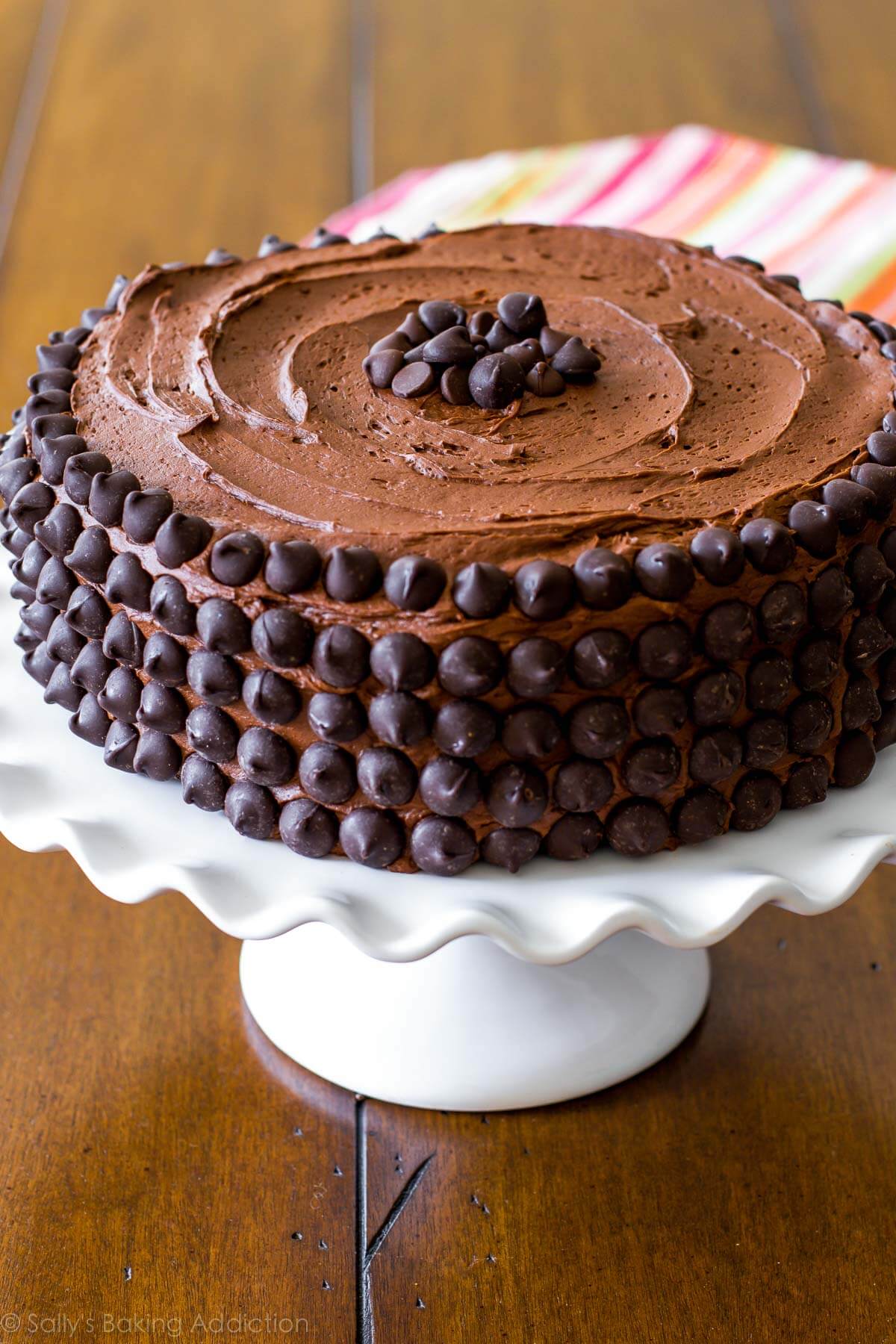 chocolate cake on white cake stand.