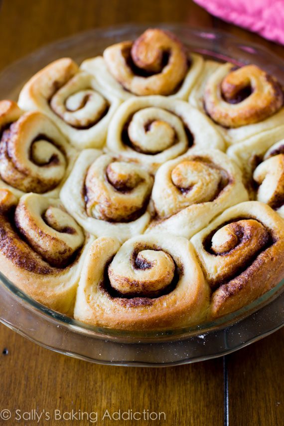 cinnamon rolls in a glass baking dish after baking