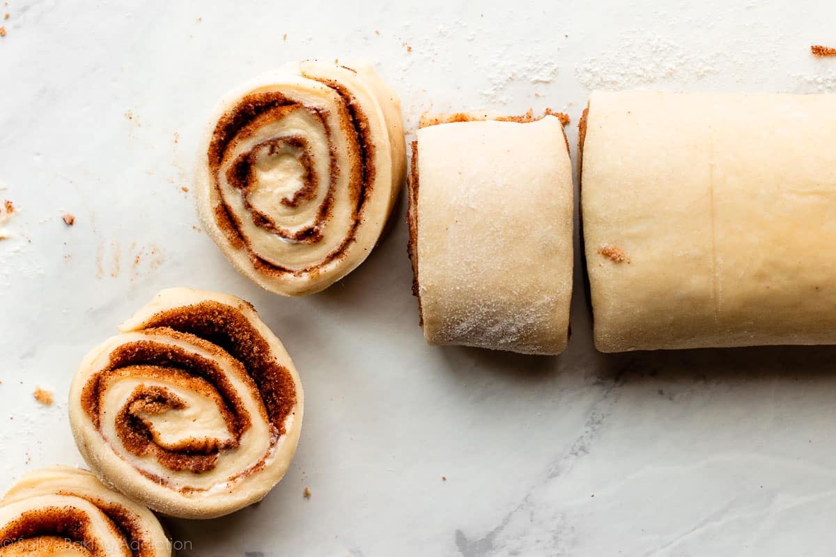 cinnamon rolls cut from long rolled-up log.