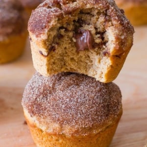 stack of cinnamon sugar muffins stuffed with Nutella with a bite taken out of one showing the middle