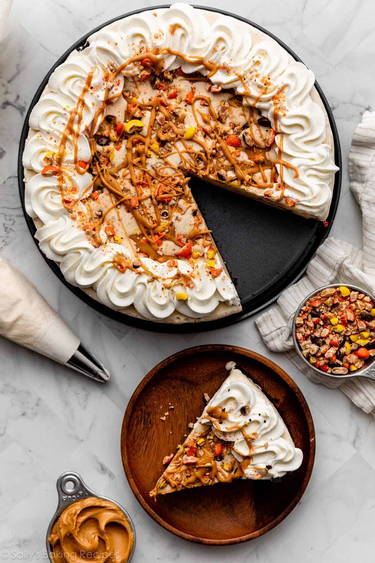 peanut butter ice cream pie on springform pan bottom and slice shown on wooden plate.