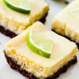 key lime pie bars on a white plate