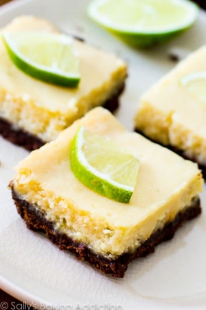 key lime pie bars on a white plate