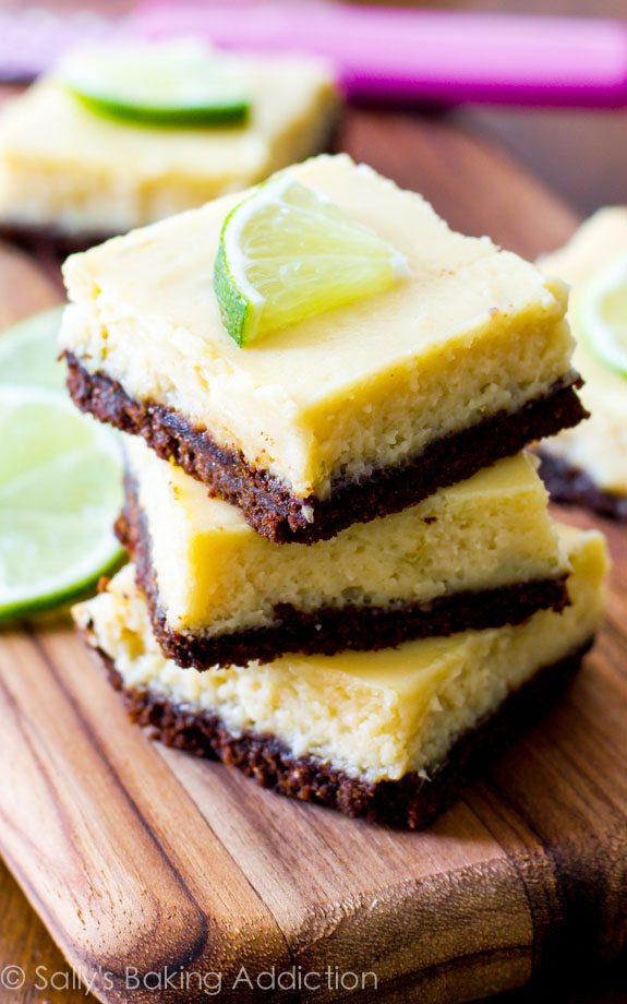 stack of key lime pie bars on a wood board