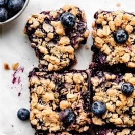 blueberry pie bars and fresh blueberries.