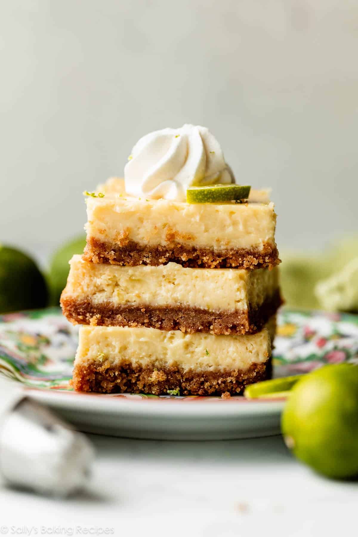 stack of 3 key lime pie bars on floral green plate.