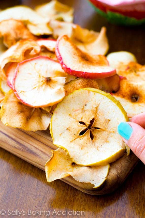 Crunchy, simple, healthy Baked Apple Chips. These are so addicting and all you are eating is apples. @sallybakeblog