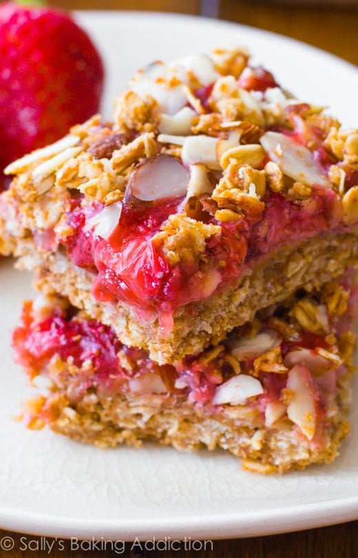 stack of strawberry oat squares on a white plate