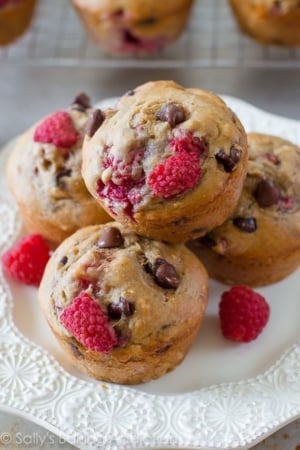 raspberry chocolate chip banana muffins on a white plate