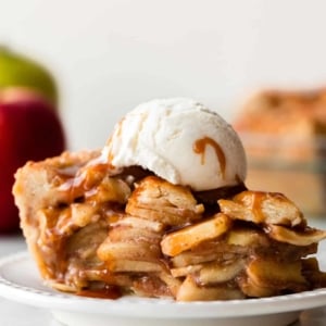salted caramel apple pie slice with vanilla ice cream on top.