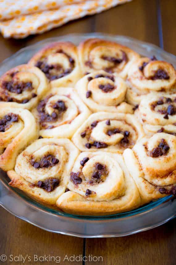 banana chocolate chip cinnamon rolls in a glass baking dish after baking