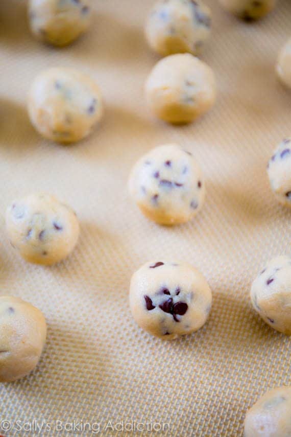 cookie dough balls on a silpat baking mat