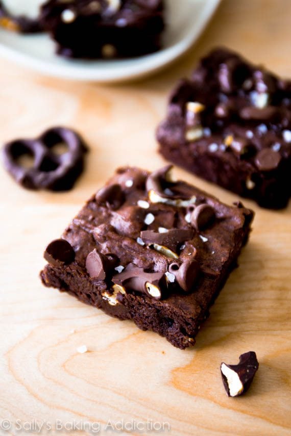 brownies with pretzels topped with chocolate chips and sea salt