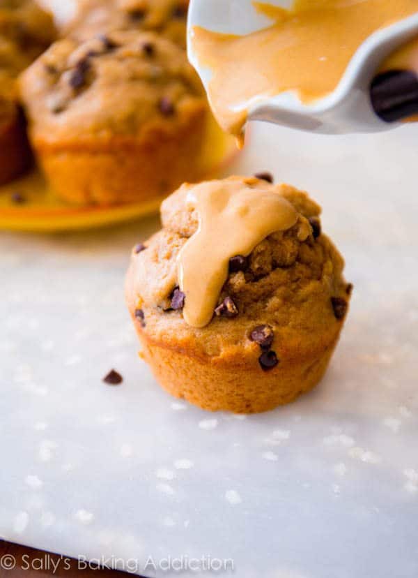 peanut butter banana muffins topped with melted peanut butter