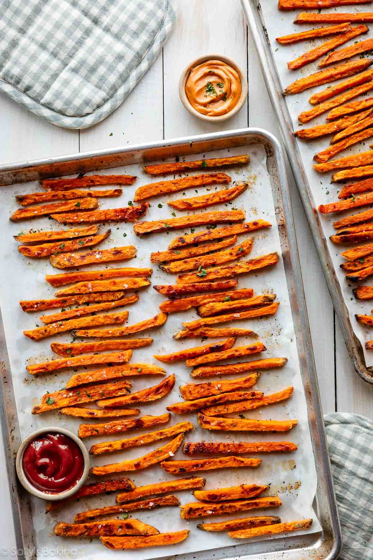 baked sweet potato fries on baking sheets.