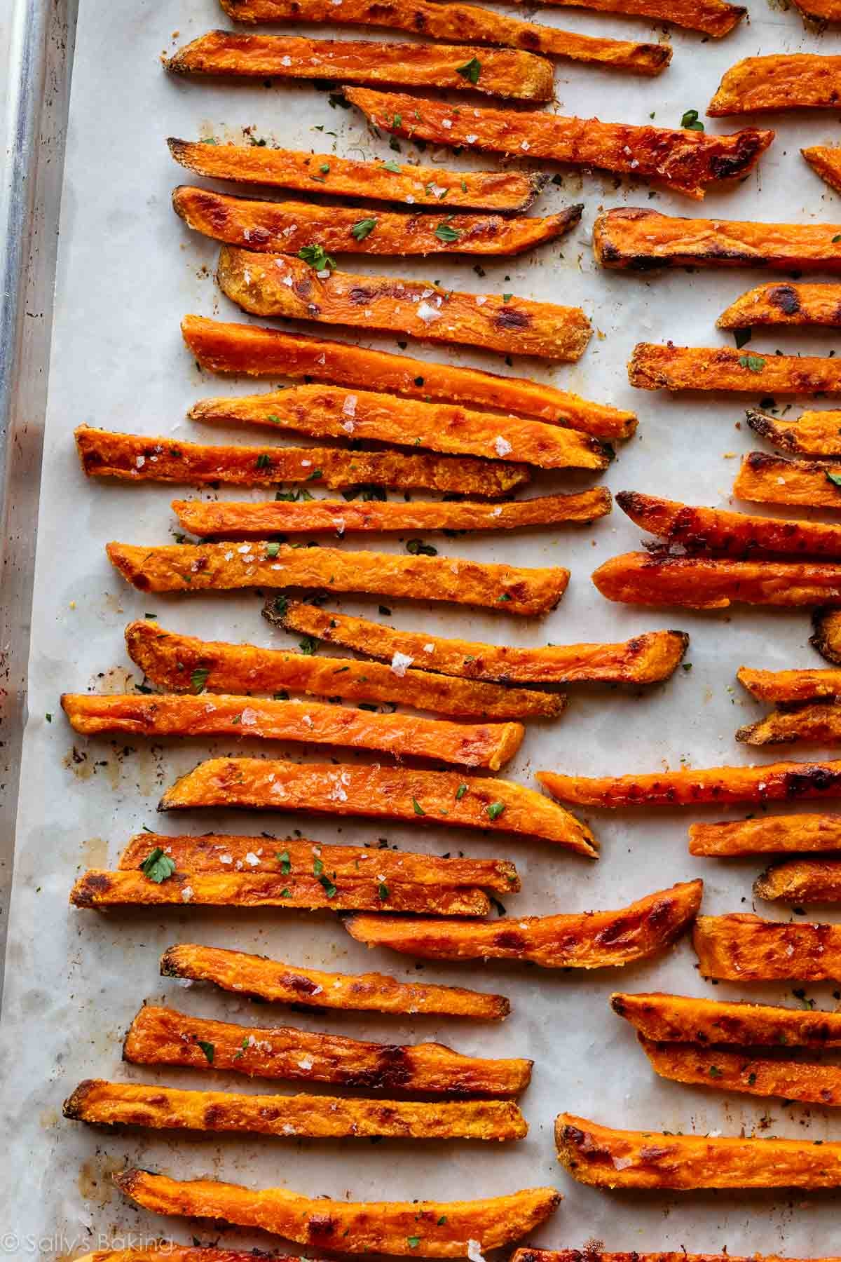 sweet potato fries lined on baking sheet.